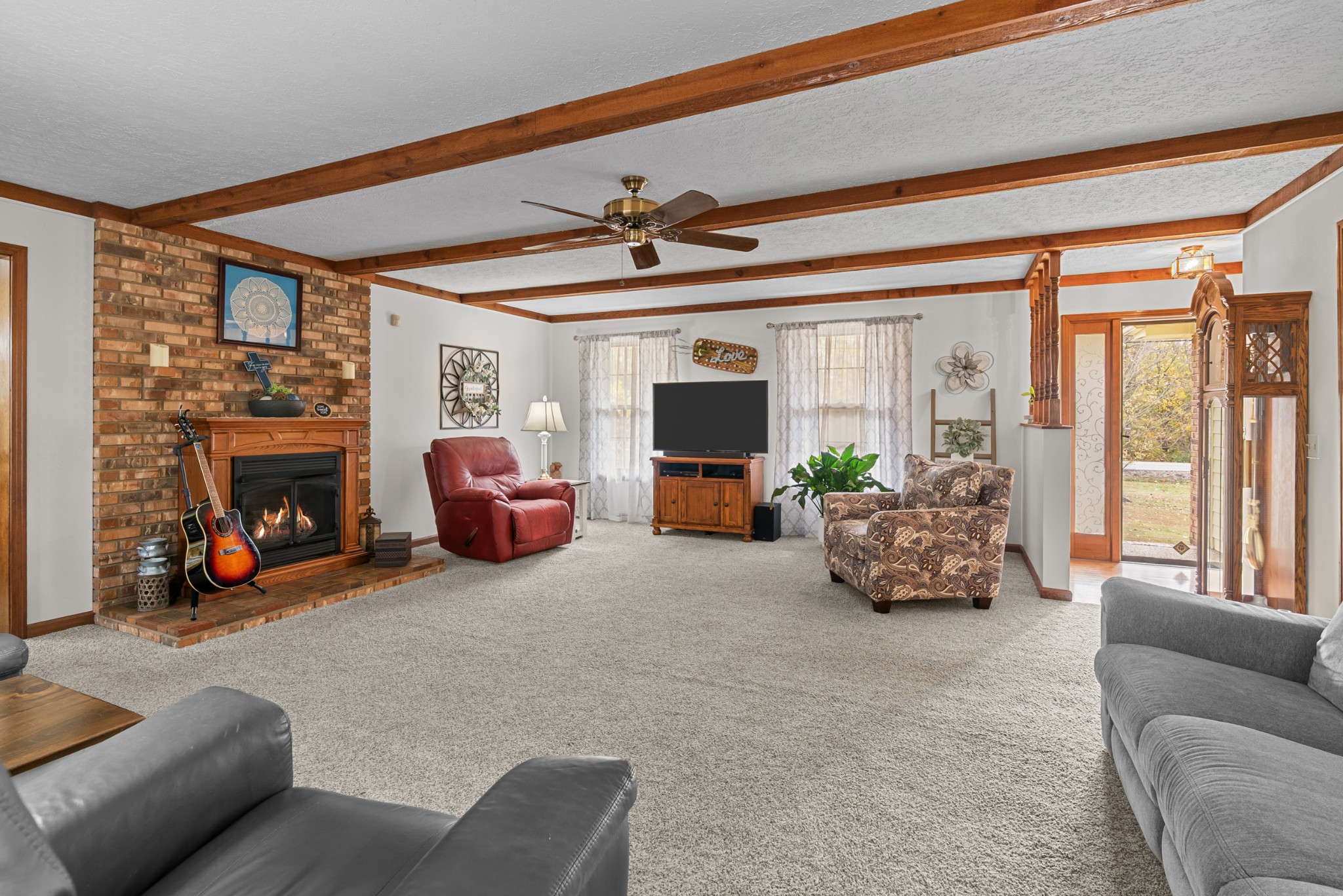 6980 Bethel Road Greenbrier, TN 37073 - Photo 9 of 51 a living room with furniture a fireplace and a large window