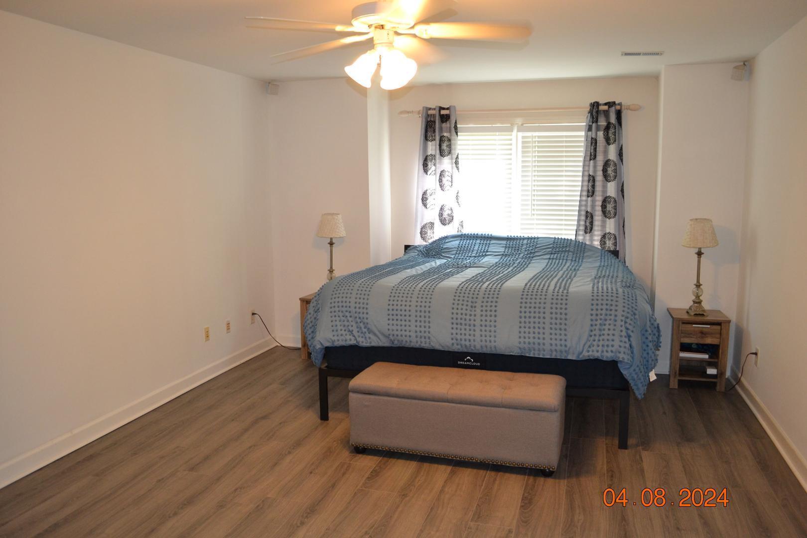 4506 Mistiflower Drive Raleigh, NC 27606 - Photo 17 of 27 a room with a bed and a window