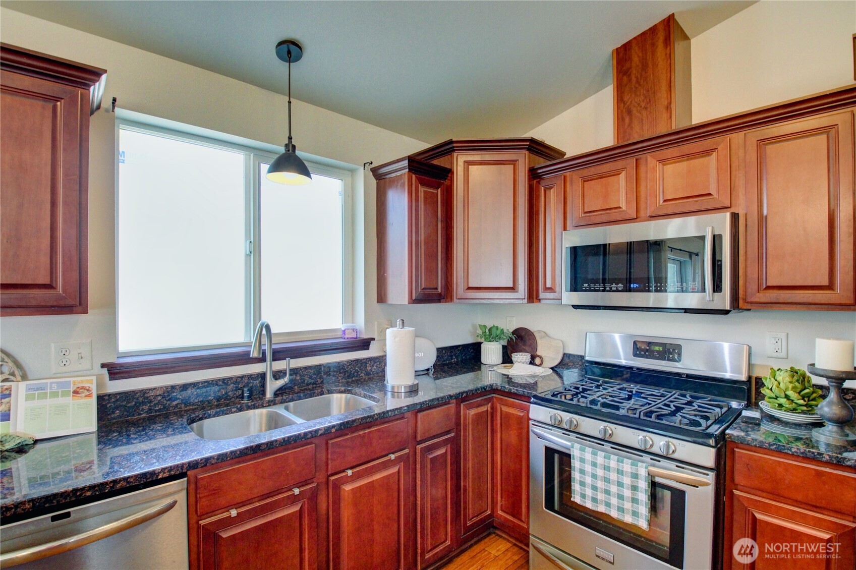 8336 Pinelli Road Sedro-Woolley, WA 98284 - Photo 4 of 15 a kitchen with stainless steel appliances granite countertop a sink stove and cabinets