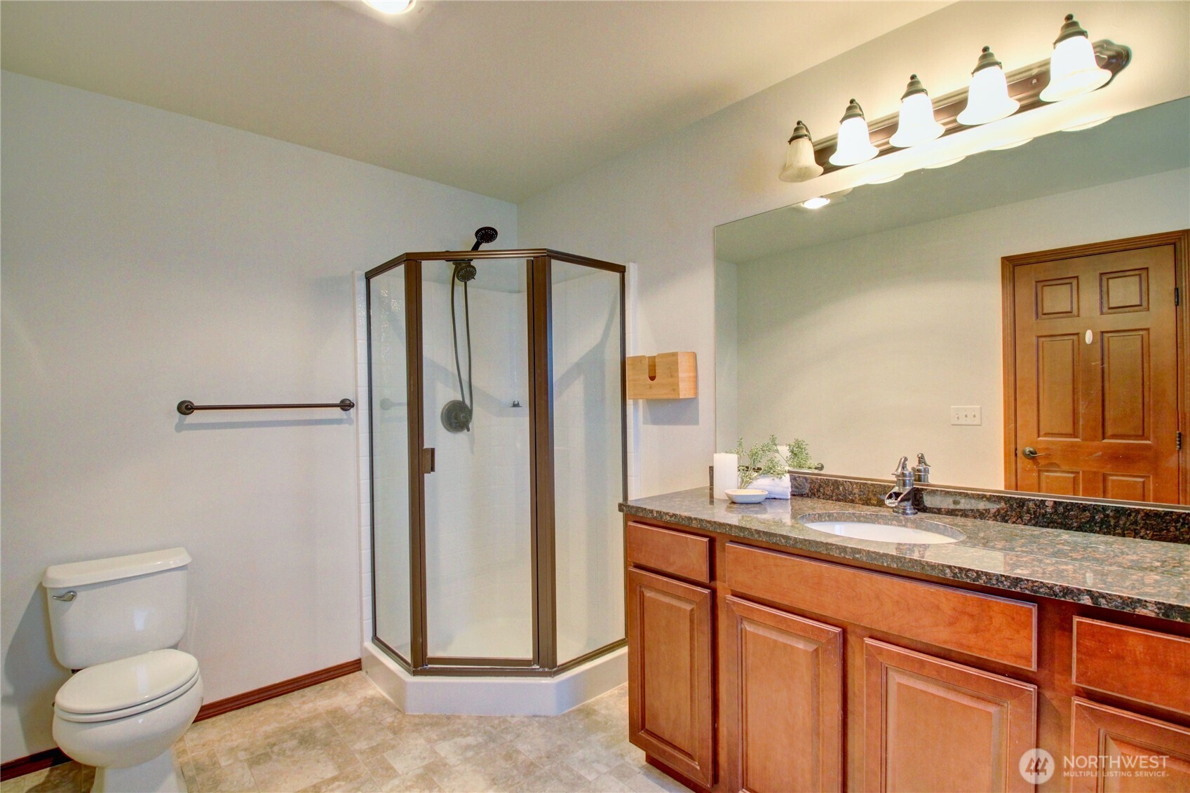 8336 Pinelli Road Sedro-Woolley, WA 98284 - Photo 8 of 15 a spacious bathroom with a granite countertop sink toilet and shower