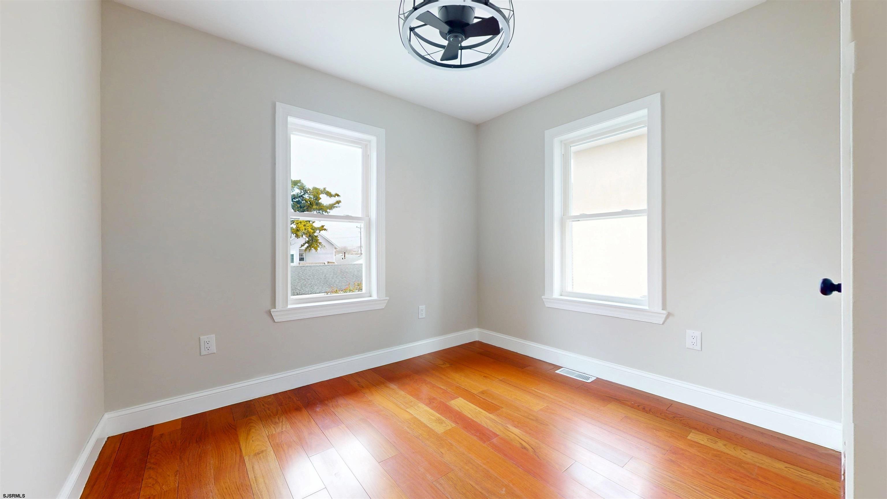 108 East 17th Avenue North Wildwood, NJ 08260 - Photo 35 of 51 a view of empty room with window and wooden floor