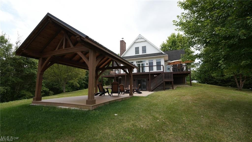 66333 Read Road Cambridge, OH 43725 - Photo 10 of 49 Rear view of property with a wooden deck, a gazebo, a patio, and a lawn