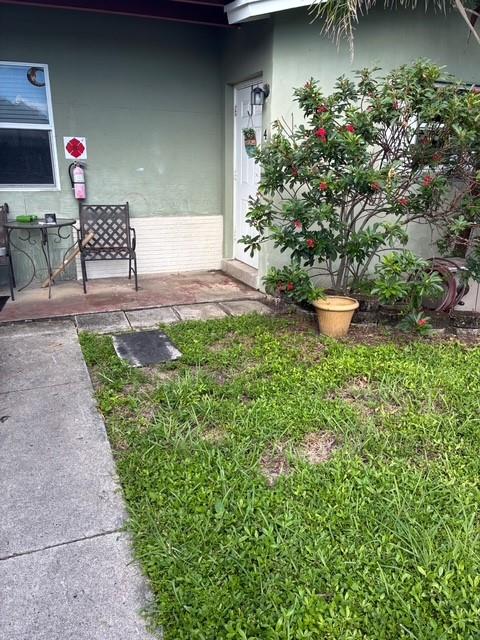 1911 Northeast 28th Street, Unit 1 Pompano Beach, FL 33064 - Photo 7 of 7 a view of a backyard with sitting area