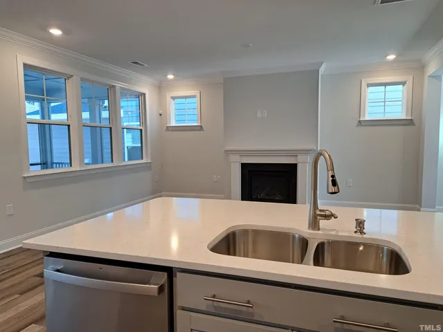 a kitchen with a sink and a microwave