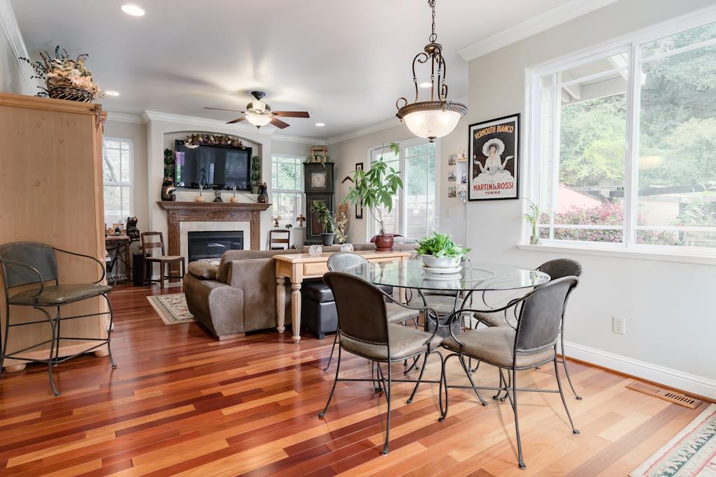 105 E Road Boulder Creek, CA 95006 - Photo 13 of 50 a view of a dining room with furniture a chandelier windows and wooden floor