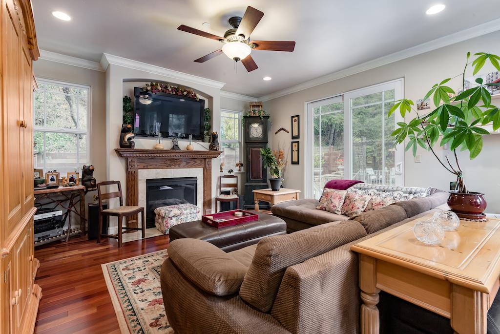 105 E Road Boulder Creek, CA 95006 - Photo 15 of 50 a living room with furniture a flat screen tv and a fireplace