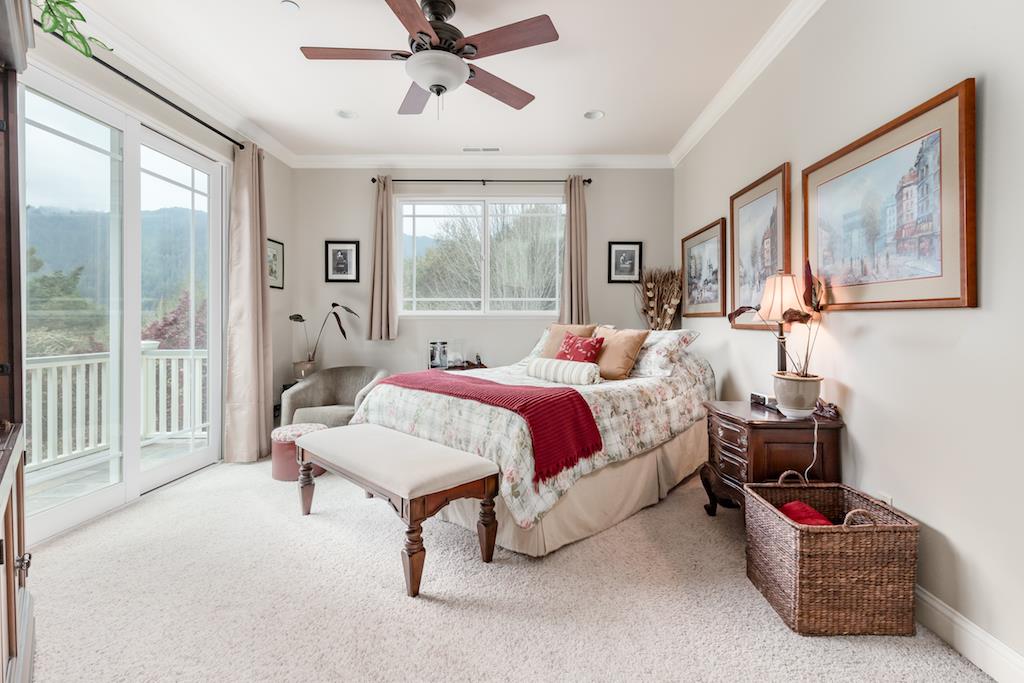 105 E Road Boulder Creek, CA 95006 - Photo 20 of 50 a bedroom with a bed couches and large window
