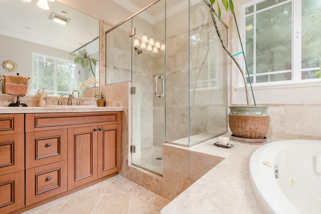 105 E Road Boulder Creek, CA 95006 - Photo 22 of 50 a spacious bathroom with a double vanity sink a mirror and a shower
