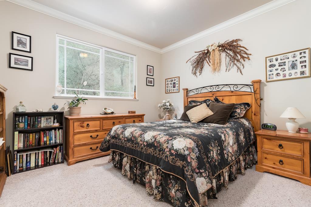105 E Road Boulder Creek, CA 95006 - Photo 23 of 50 a bedroom with a bed and a window