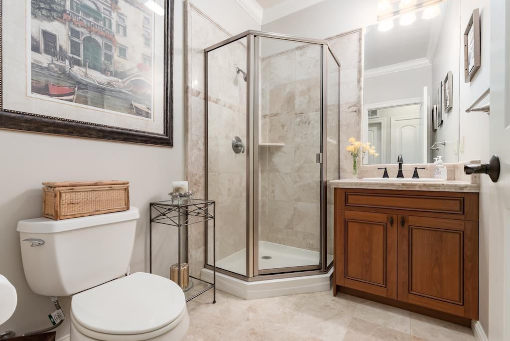 105 E Road Boulder Creek, CA 95006 - Photo 25 of 50 a bathroom with a toilet a sink and glass door