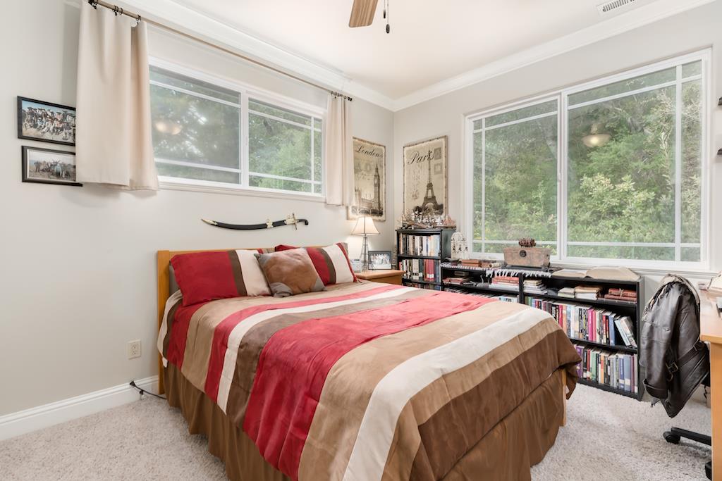 105 E Road Boulder Creek, CA 95006 - Photo 26 of 50 a bedroom with a bed and a large window