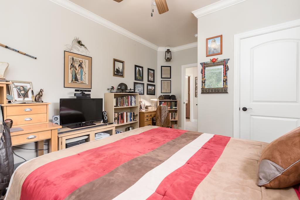 105 E Road Boulder Creek, CA 95006 - Photo 27 of 50 a bedroom with a bed and a flat screen tv