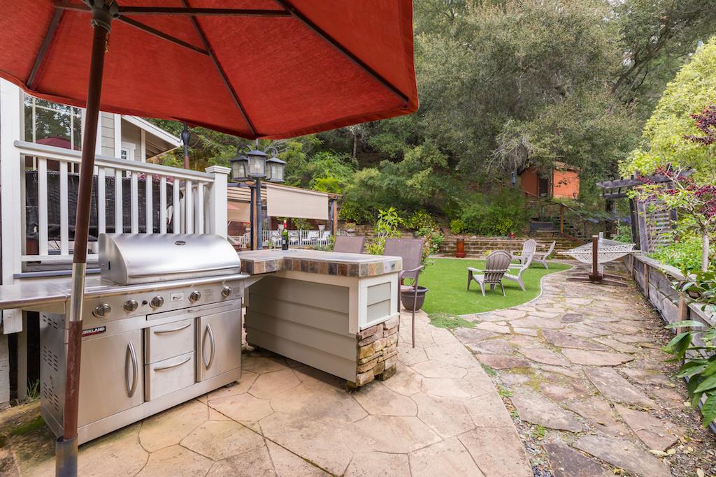 105 E Road Boulder Creek, CA 95006 - Photo 33 of 50 a view of a chairs and table under an umbrella