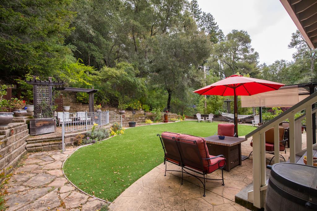 105 E Road Boulder Creek, CA 95006 - Photo 35 of 50 a view of a backyard with a patio and garden