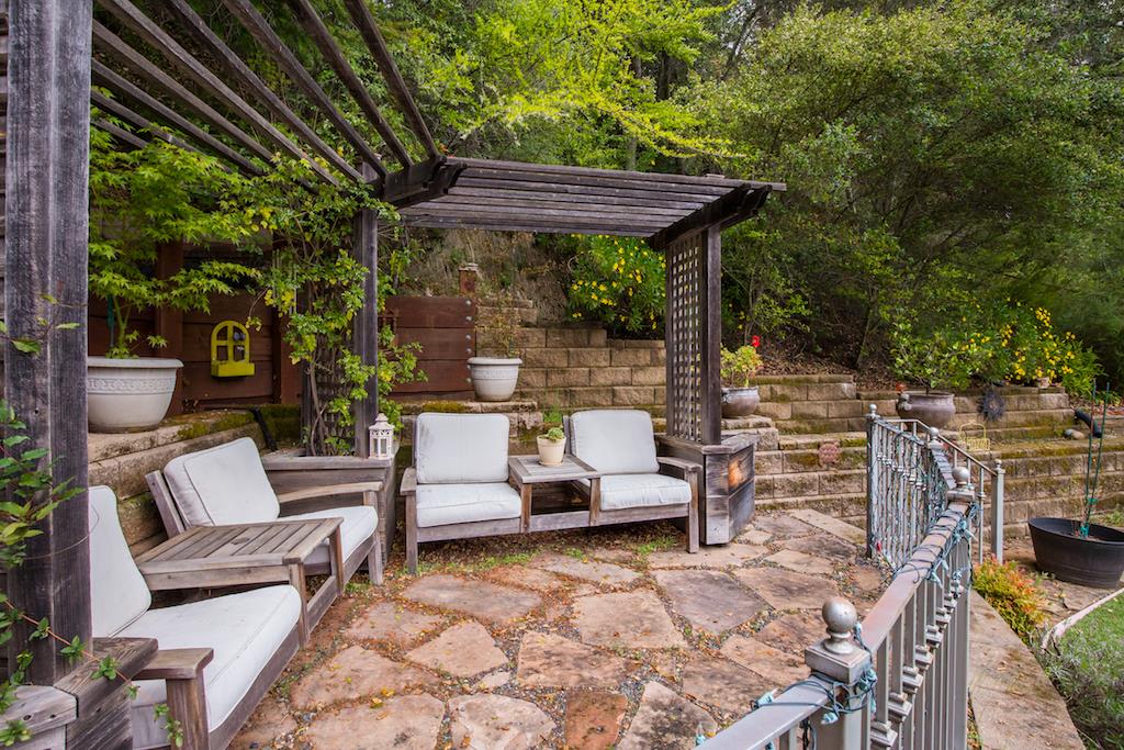 105 E Road Boulder Creek, CA 95006 - Photo 37 of 50 a view of patio with couches and chairs under an umbrella