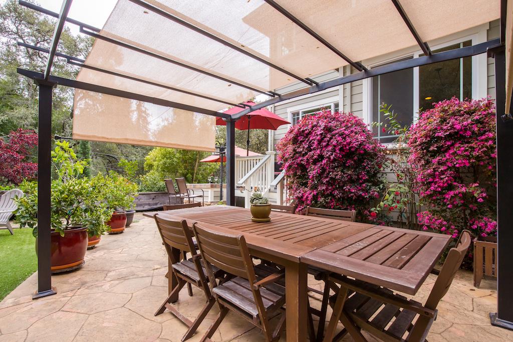 105 E Road Boulder Creek, CA 95006 - Photo 40 of 50 a view of a patio with a table and chairs and potted plants