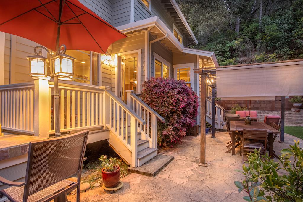 105 E Road Boulder Creek, CA 95006 - Photo 47 of 50 a view of a patio with a table and chairs under an umbrella