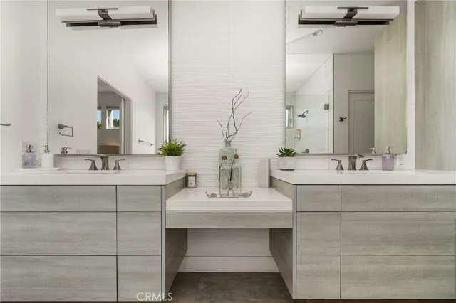a living room with furniture and a painting on the wall
