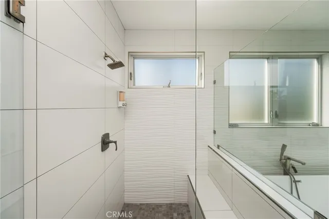 a bathroom with a toilet a sink and shower
