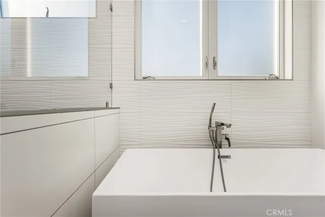 a bathroom with a toilet and a sink