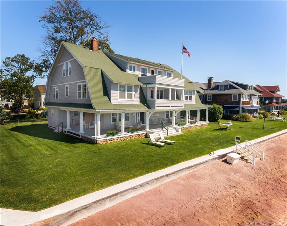 a front view of a house with a yard table and chairs