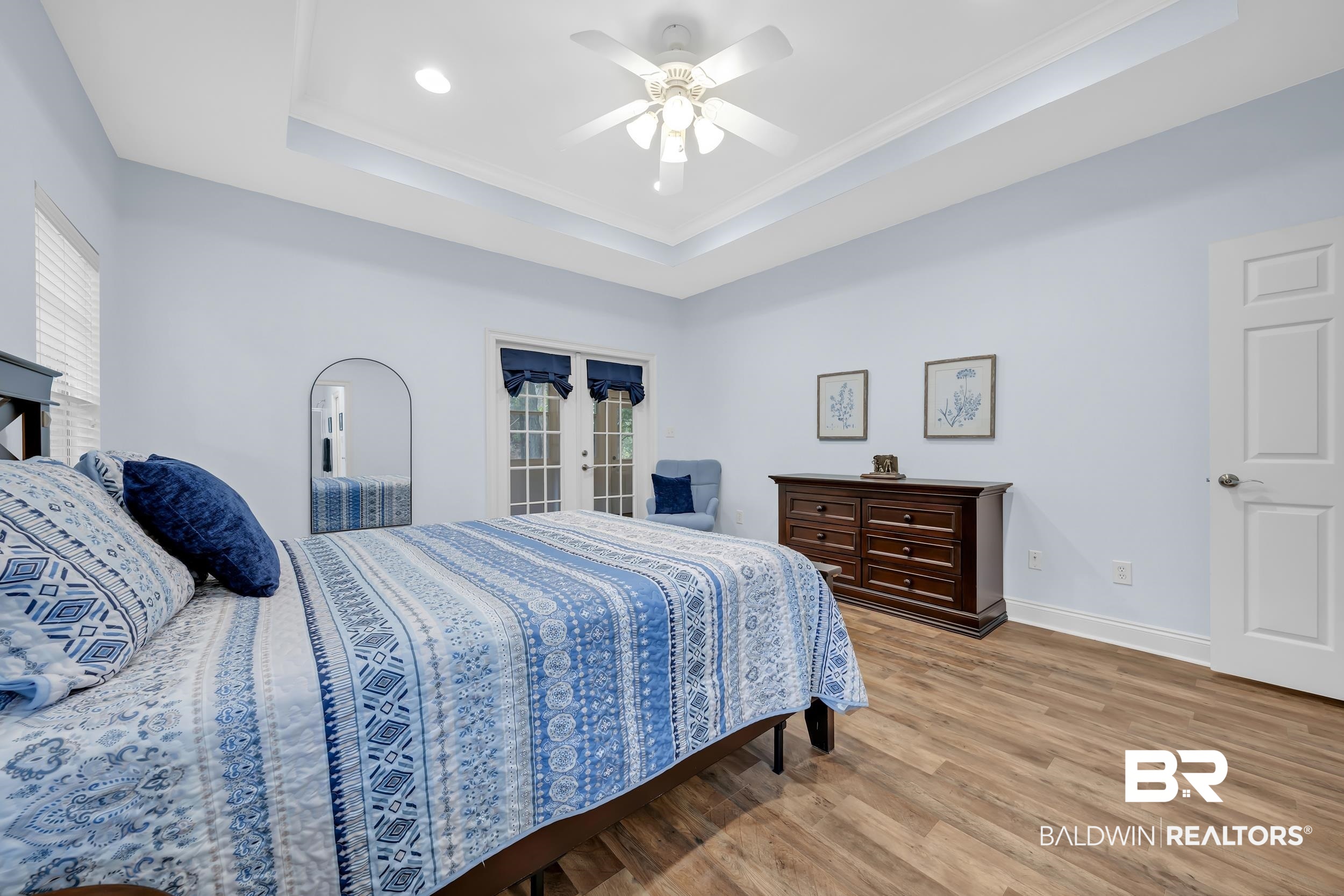 105 Mark Twain Loop Foley, AL 36535 - Photo 14 of 43 Bedroom with french doors, wood finished floors, ceiling fan, a raised ceiling, and access to exterior