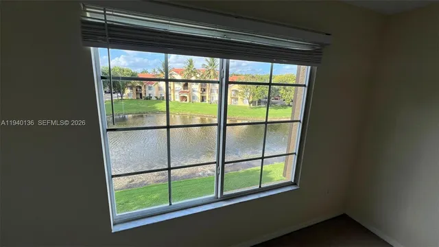 a view of a room that has a big window