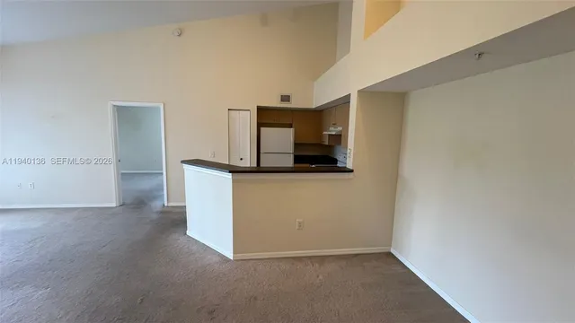 a view of a kitchen cabinets and a utility room