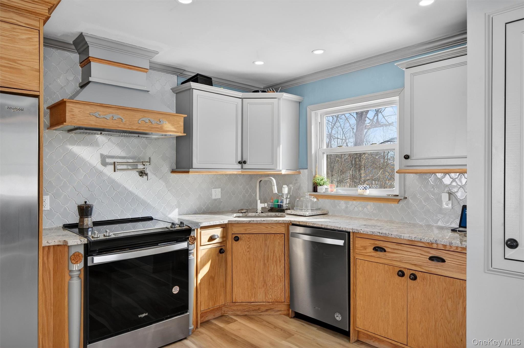 51 East Green Road Rock Tavern, NY 12575 - Photo 14 of 43 a kitchen with stainless steel appliances granite countertop a sink a stove a microwave and wooden cabinets