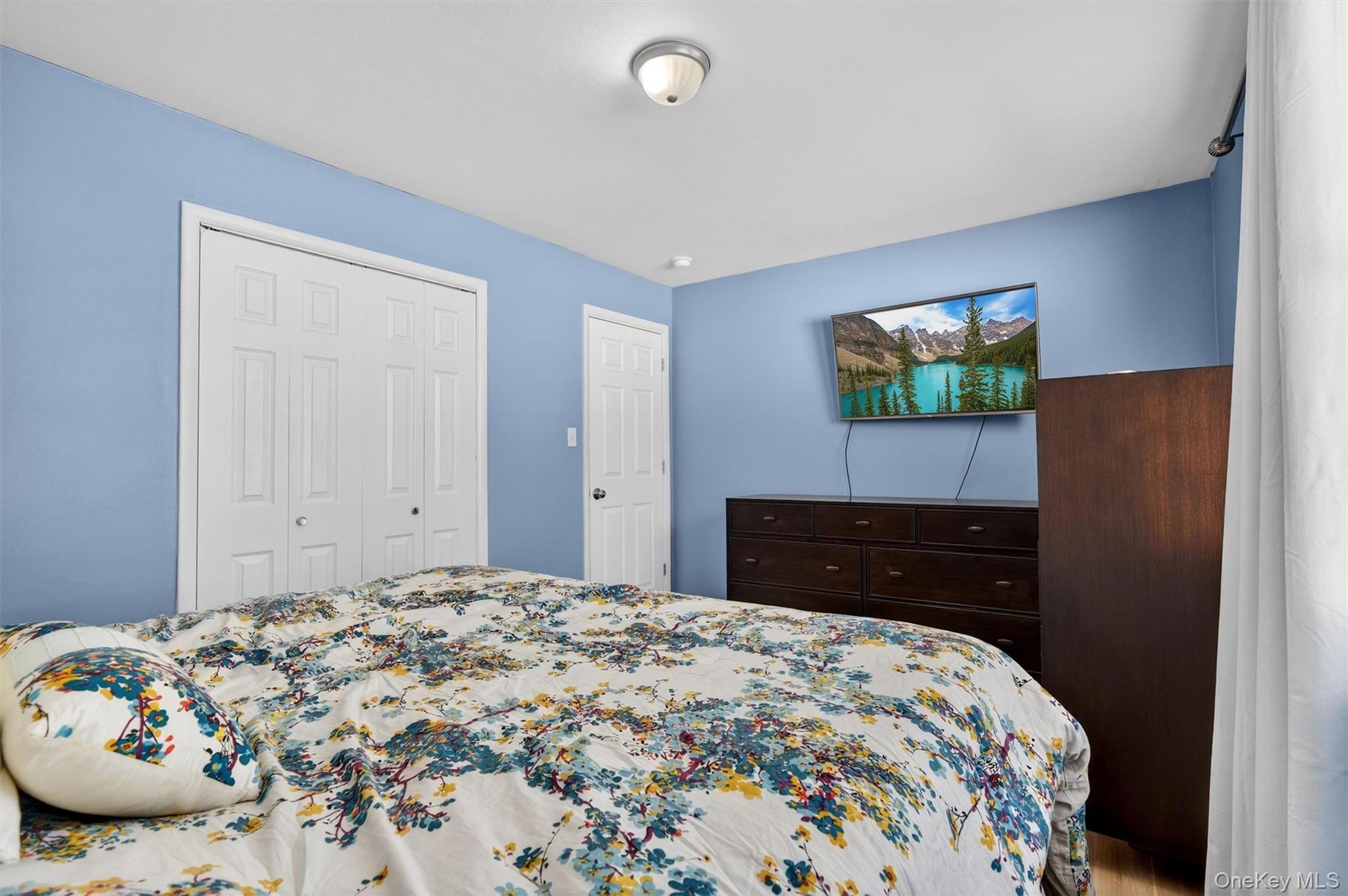51 East Green Road Rock Tavern, NY 12575 - Photo 21 of 43 a bedroom with a bed and a flat screen tv