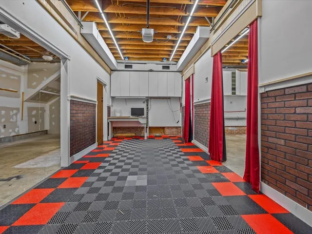 a room with musical instruments and wooden floor