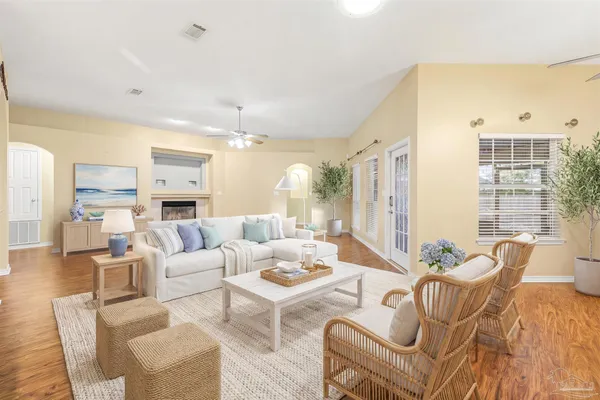 a living room with furniture and a large window