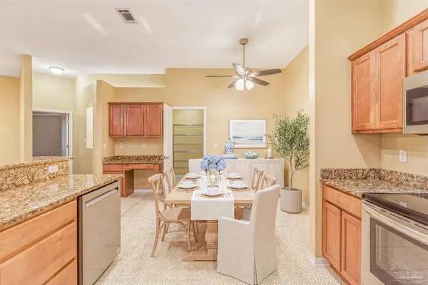 a view of a kitchen area with furniture and chandelier