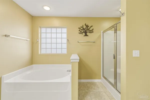 a bathroom with a bathtub and shower
