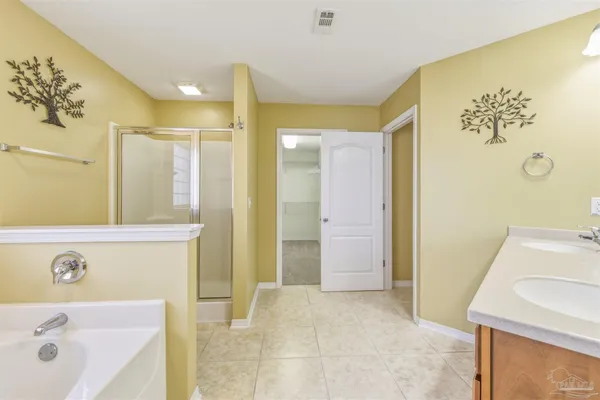 a bathroom with a sink a mirror and a bathtub