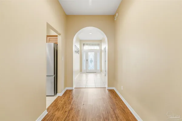 a view of a livingroom with wooden floor and a window