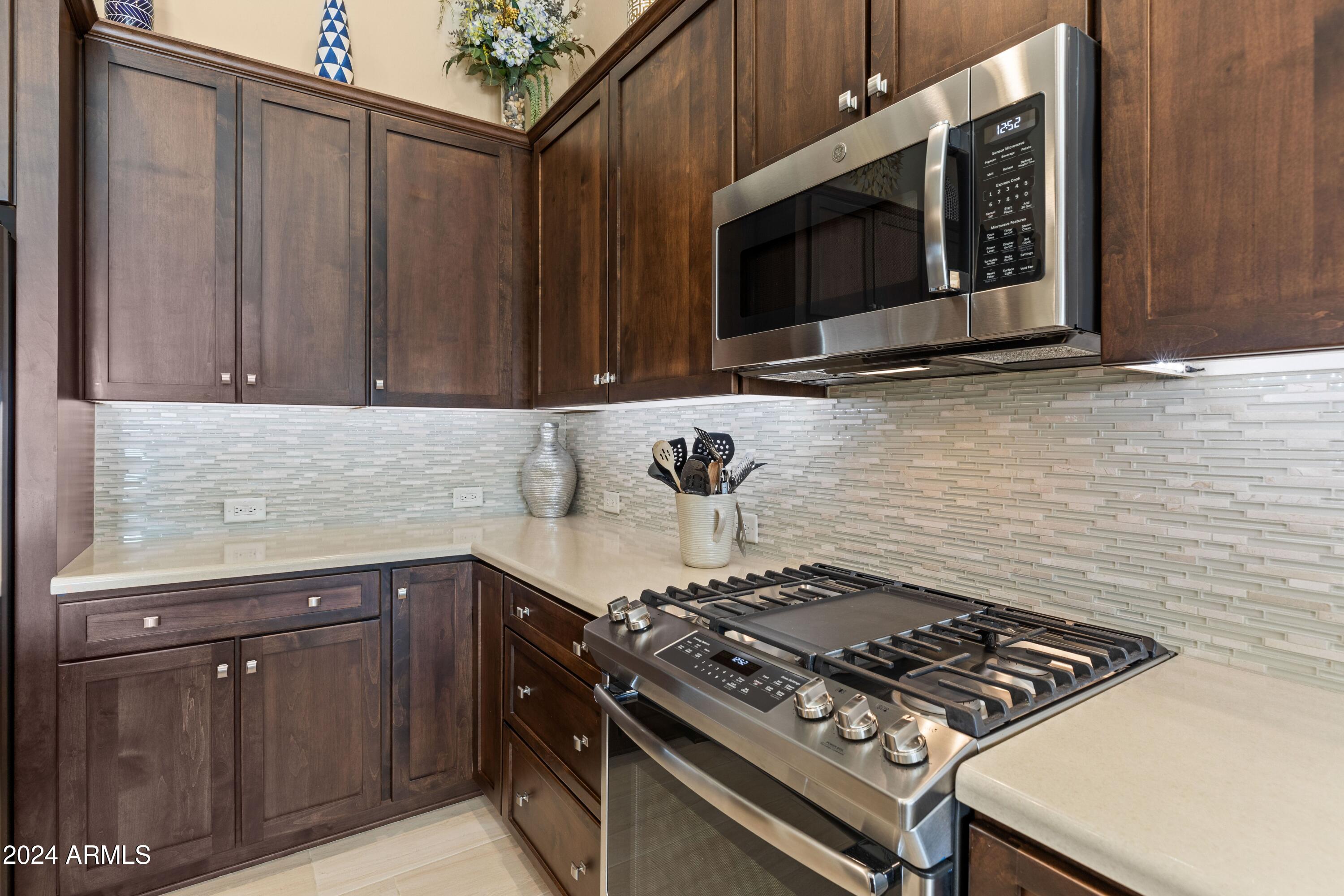16807 W Berkeley Rd. kitchen cab -range