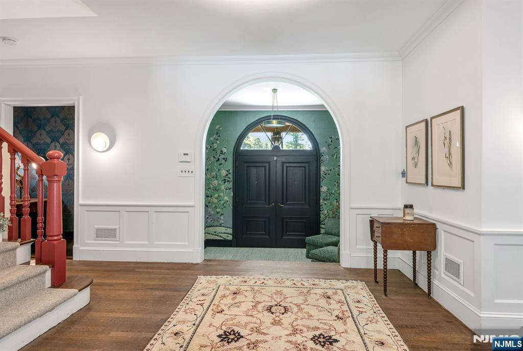 681 Closter Dock Road Closter, NJ 07624 - Photo 3 of 40 a living room with a rug and a window