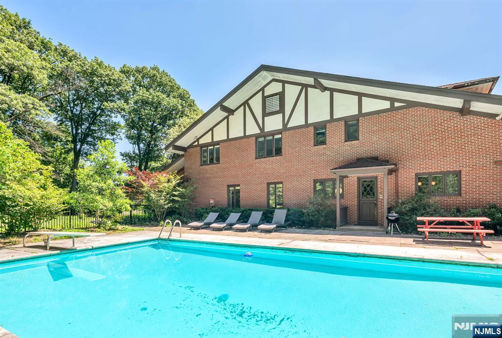 681 Closter Dock Road Closter, NJ 07624 - Photo 31 of 40 a front view of a house with a yard