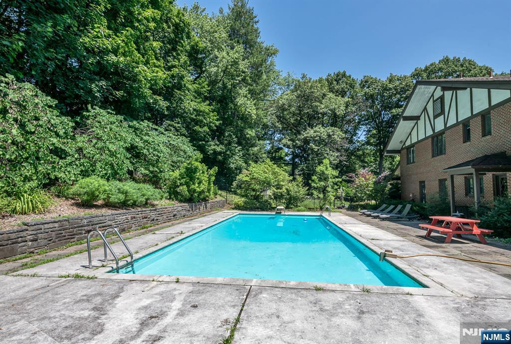 681 Closter Dock Road Closter, NJ 07624 - Photo 33 of 40 an outdoor space with pool and furniture