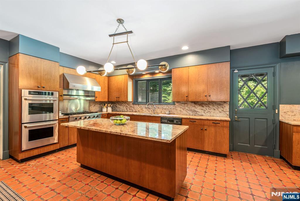 681 Closter Dock Road Closter, NJ 07624 - Photo 9 of 40 a kitchen with stainless steel appliances granite countertop a stove a sink and a refrigerator