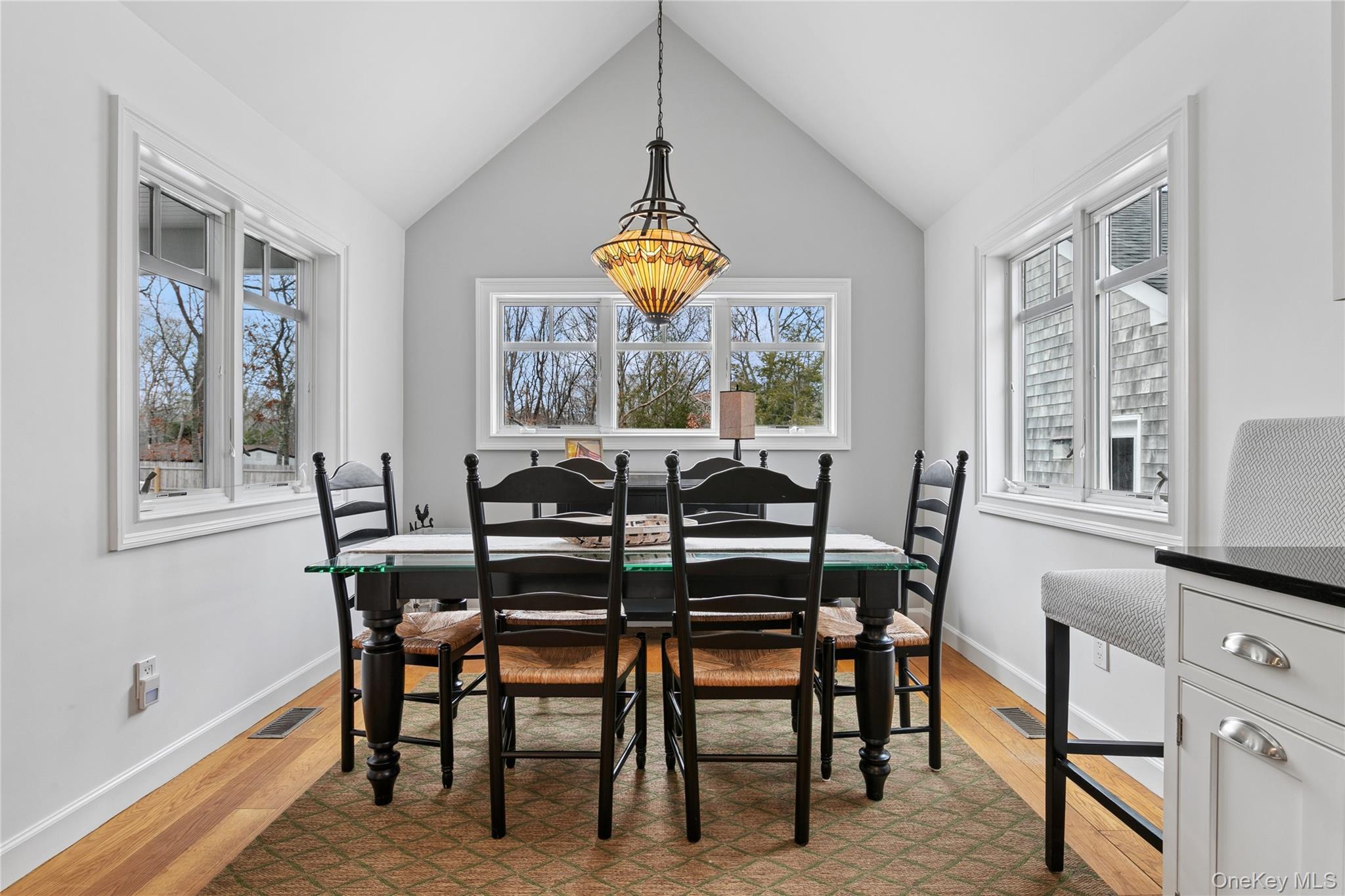 10 Foxboro Road East Quogue, NY 11946 - Photo 15 of 31 a dining room with furniture and window