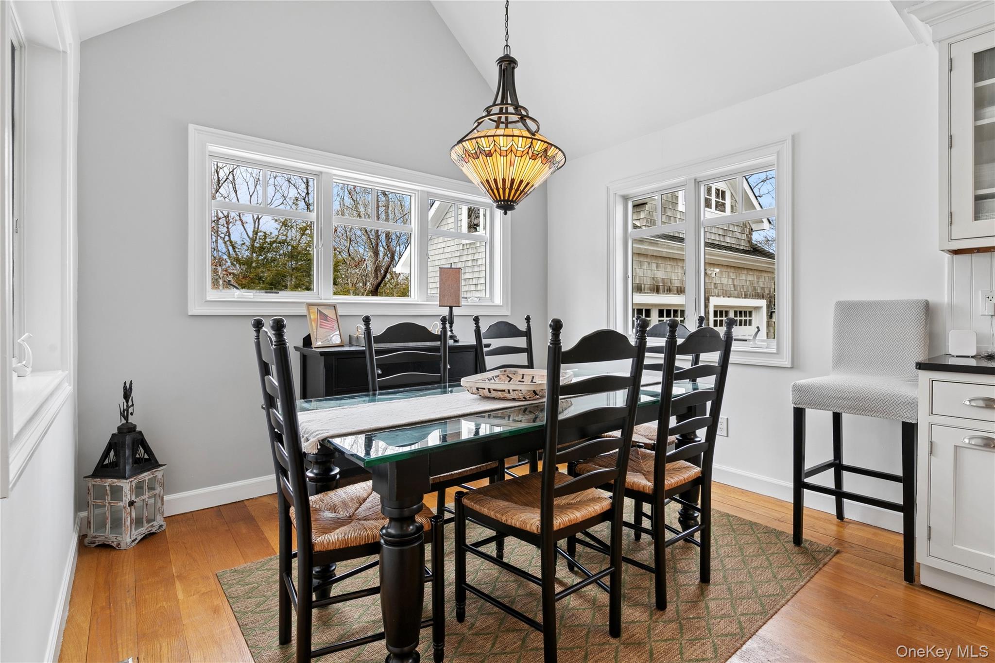 10 Foxboro Road East Quogue, NY 11946 - Photo 16 of 31 a view of a dining room with furniture window and wooden floor