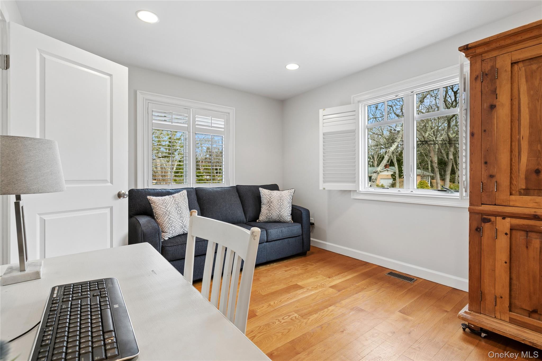 10 Foxboro Road East Quogue, NY 11946 - Photo 17 of 31 a bedroom with furniture and a window