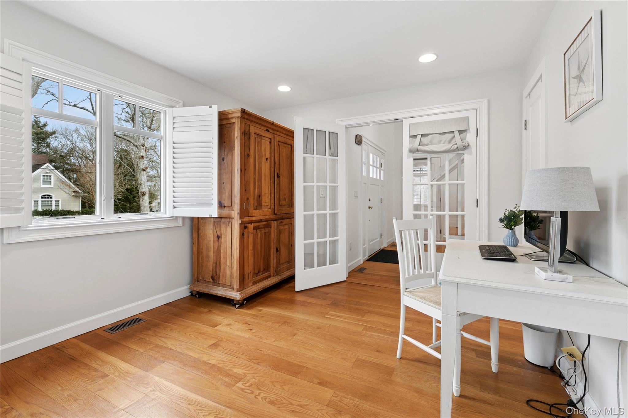 10 Foxboro Road East Quogue, NY 11946 - Photo 19 of 31 a view of a kitchen with furniture wooden floor and window