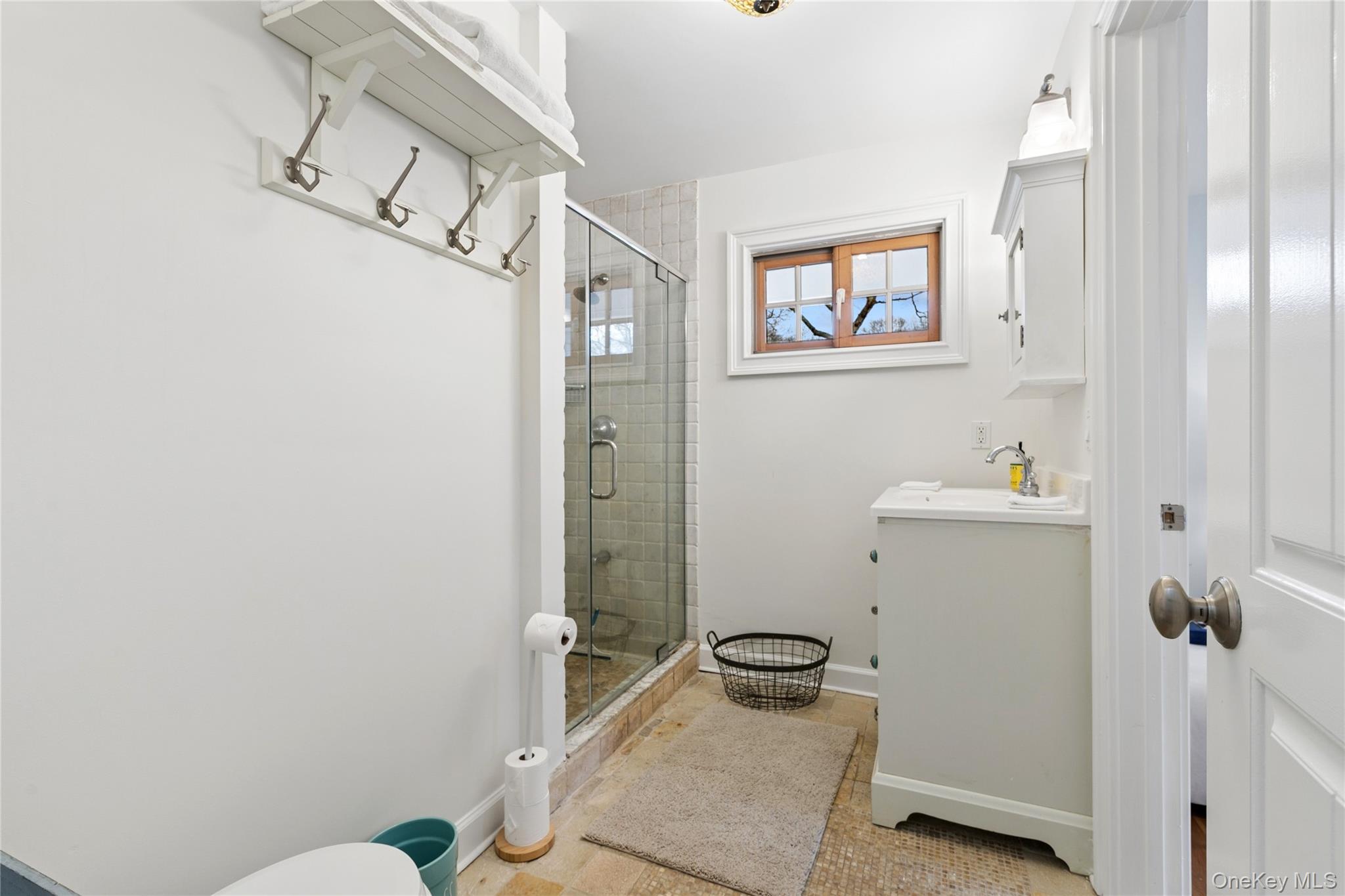 10 Foxboro Road East Quogue, NY 11946 - Photo 20 of 31 a bathroom with a sink and a mirror