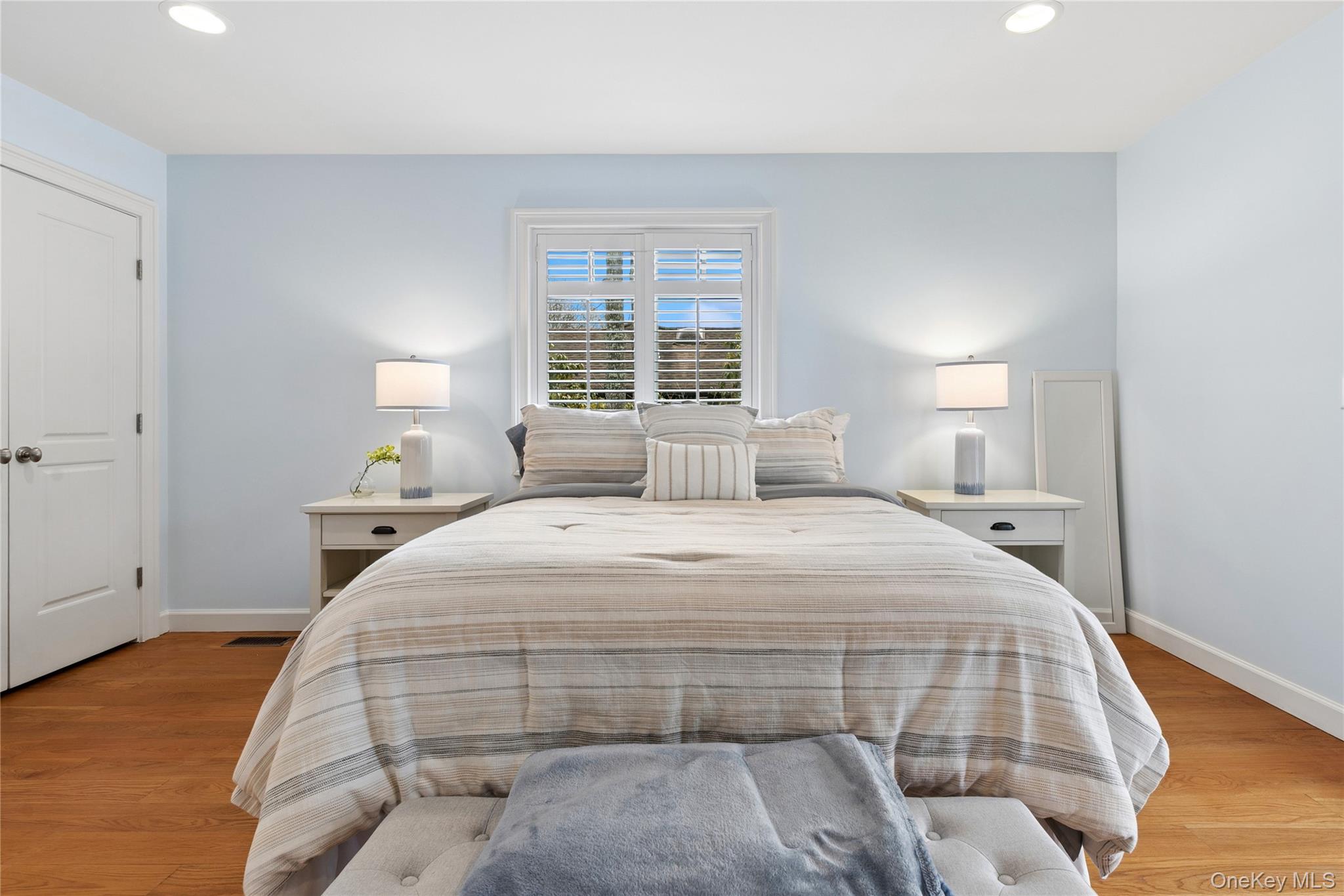 10 Foxboro Road East Quogue, NY 11946 - Photo 27 of 31 a bedroom with a bed and a night stand