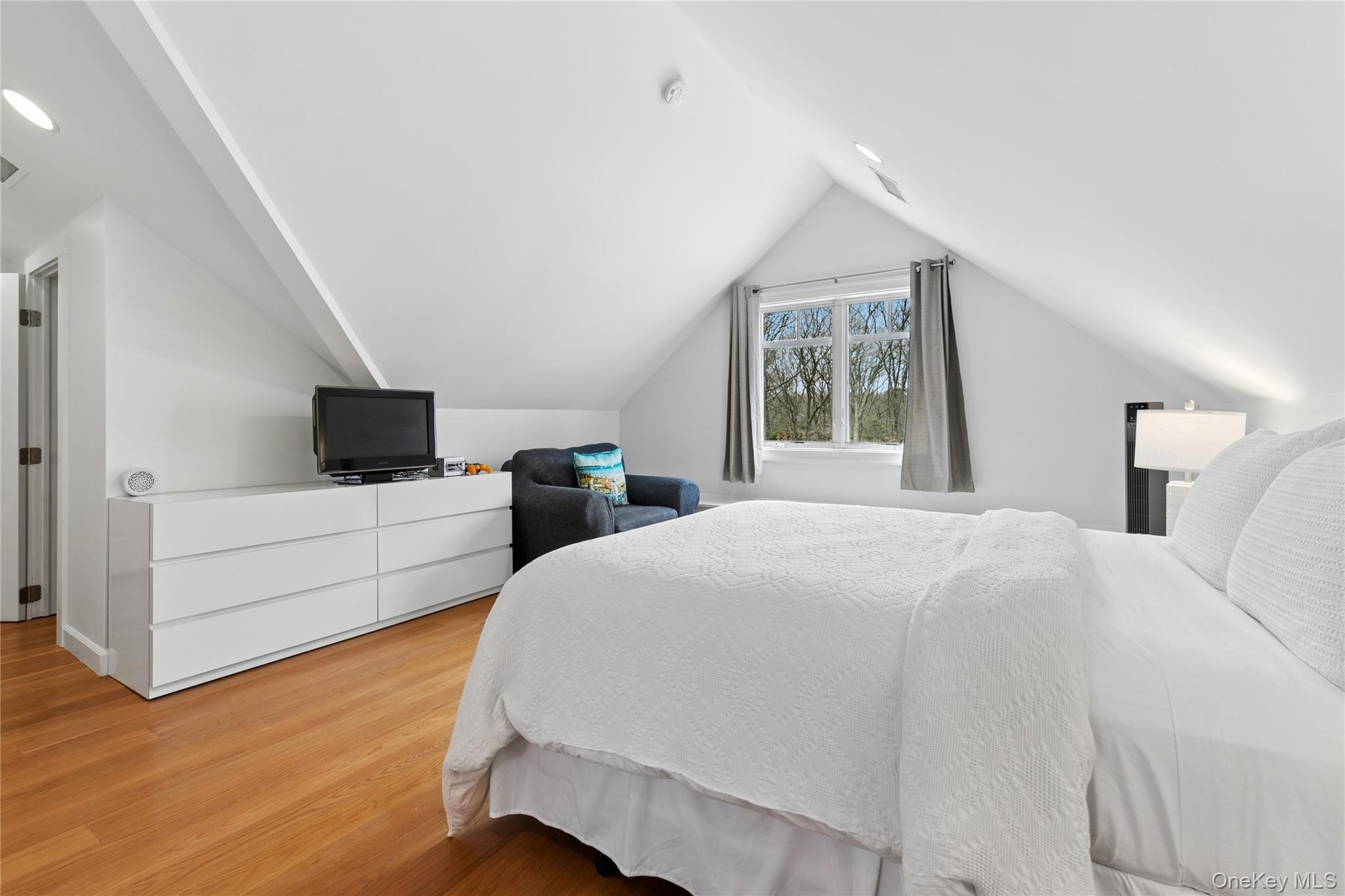 10 Foxboro Road East Quogue, NY 11946 - Photo 29 of 31 a bedroom with a bed and a flat screen tv