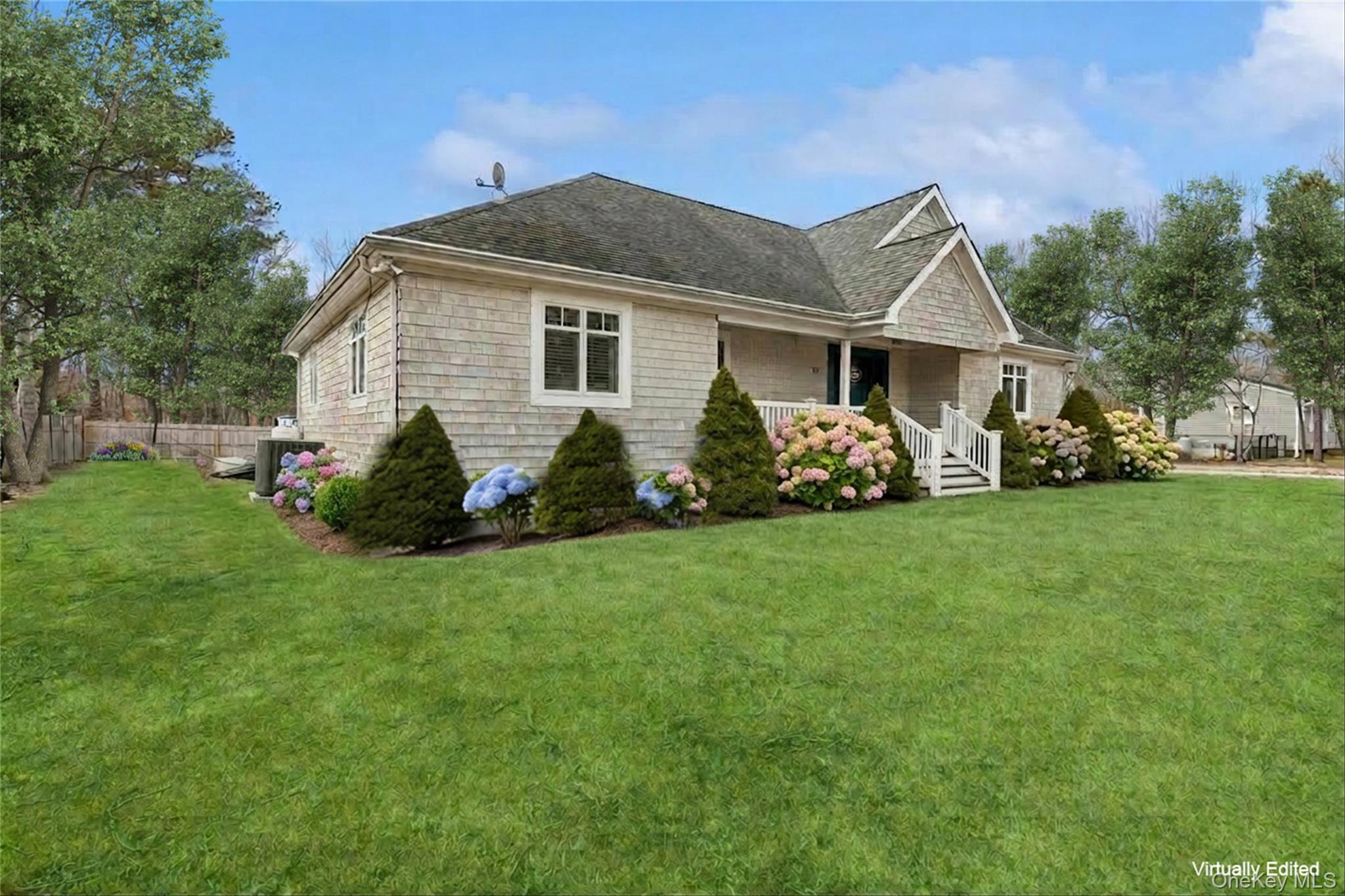 10 Foxboro Road East Quogue, NY 11946 - Photo 3 of 31 a view of a house with a yard and plants
