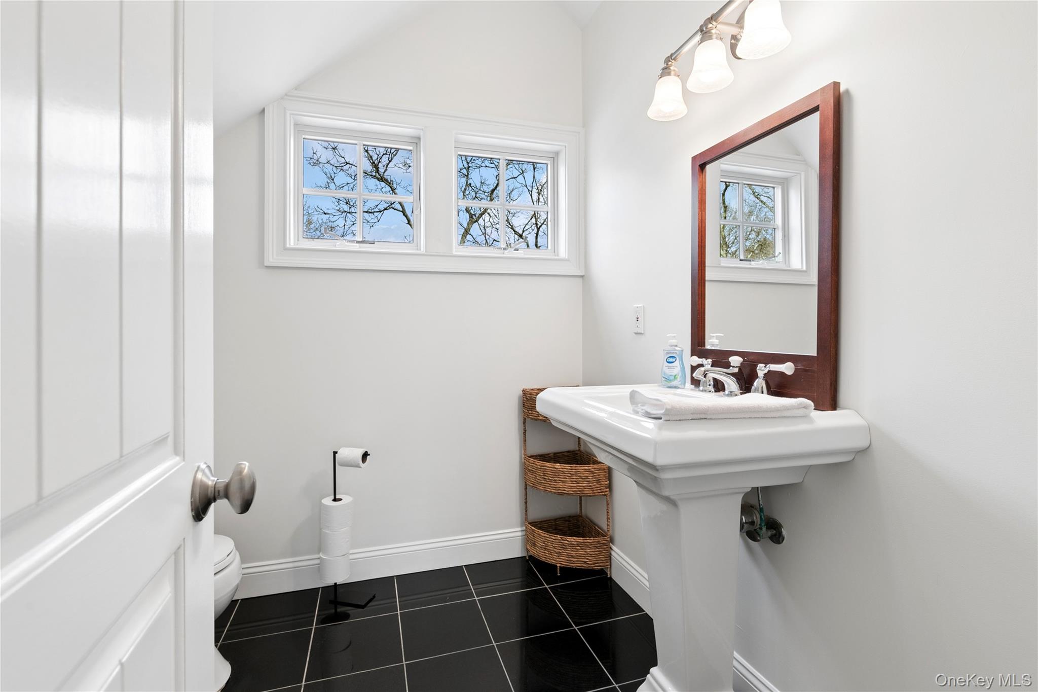 10 Foxboro Road East Quogue, NY 11946 - Photo 31 of 31 a bathroom with a sink and a mirror